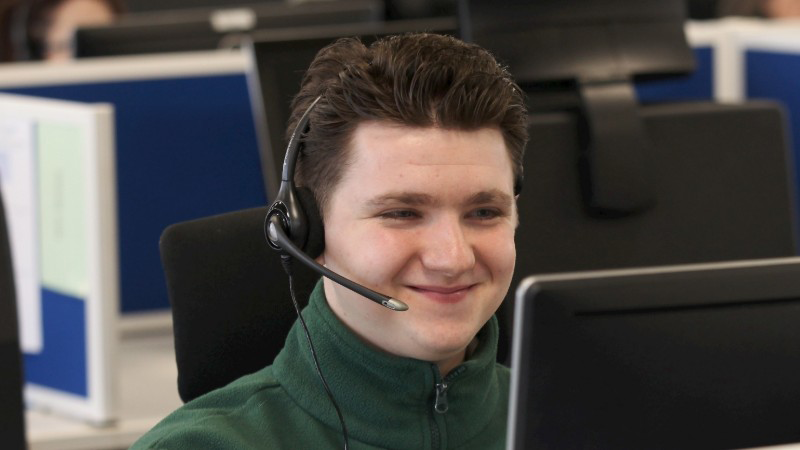 Male health advisor working at his desk.