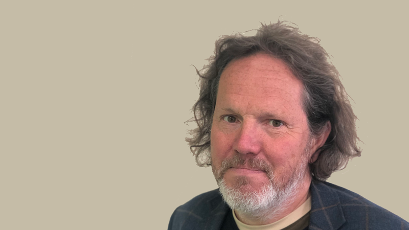 Dr David Hanley smiling.