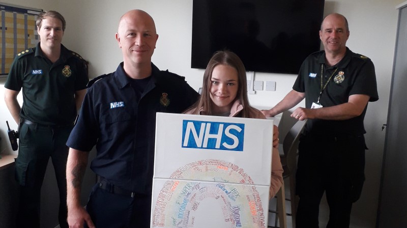 Megan and Cameron stood with two NWAS staff in uniform