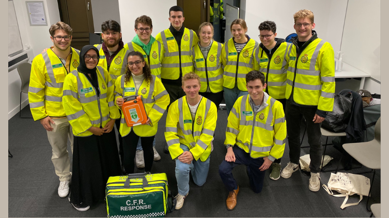 The Lancaster Medics CFR team group shot in high vis jackets with response bag