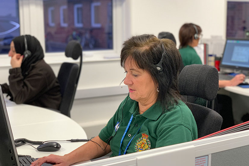 Staff member with headset taking a call.