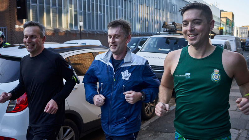 Chief Executive Daren Mochrie and London Ambulance Chielf Executive Damiel Elkeles running with paramedic.