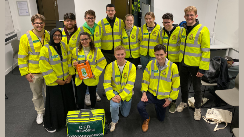 The Lancaster Medics CFR team group shot in high vis jackets with response bag 