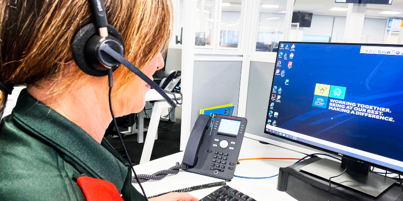 Woman clinical advisor answering public calls to NHS 111 service