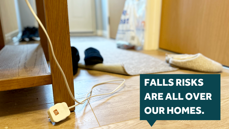 cluttered hallway with trailing wires, slippers and loose rug. Text reads falls risks are all over our homes