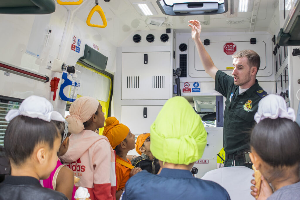 Group of school children in an ambulance.
