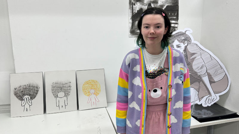 Illustration student Holly Gallagher with her designs 
