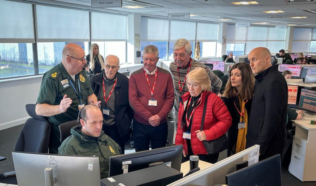 Head of Operations for Cheshire and Merseyside Dave Kitchin, giving Ray and his family a tour of the Emergency Operation Centre (EOC).