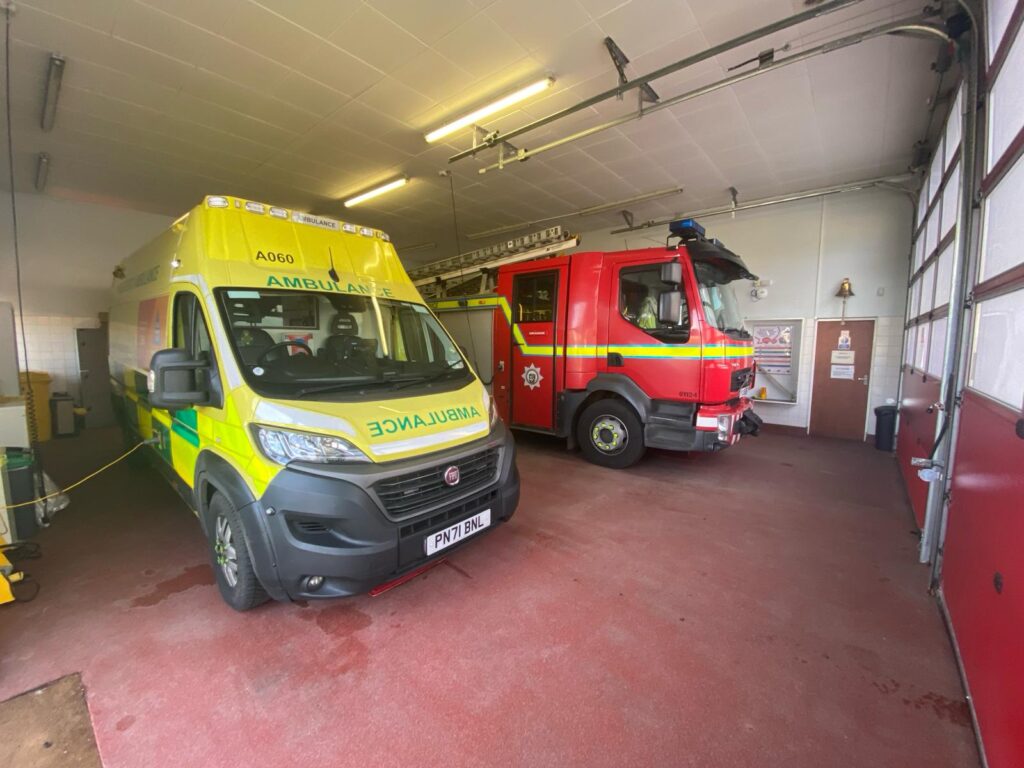 Ambulance and Fire Engine, parked inside the station