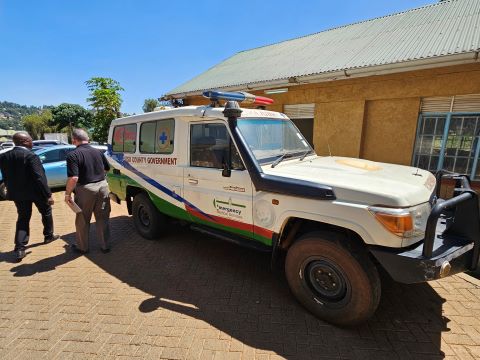 An ambulance outside of a building.
