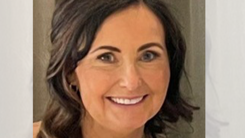 head shot of a woman with brown hair she is smiling 