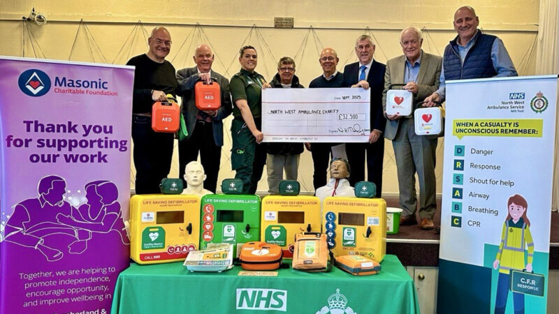 Masons cheque presentation group pic