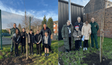 Children planting trees and standing and smiling with their teachers and an NWAS staff member.