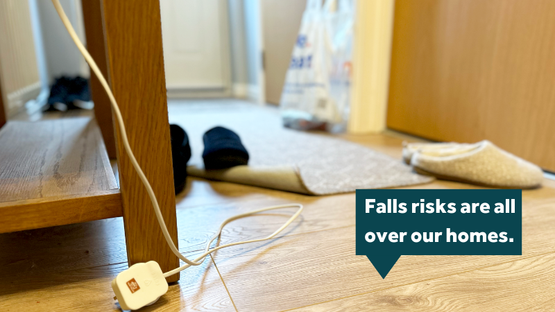 A hallway showing lots of clutter on the floor with text that reads: Falls risks are all over our homes