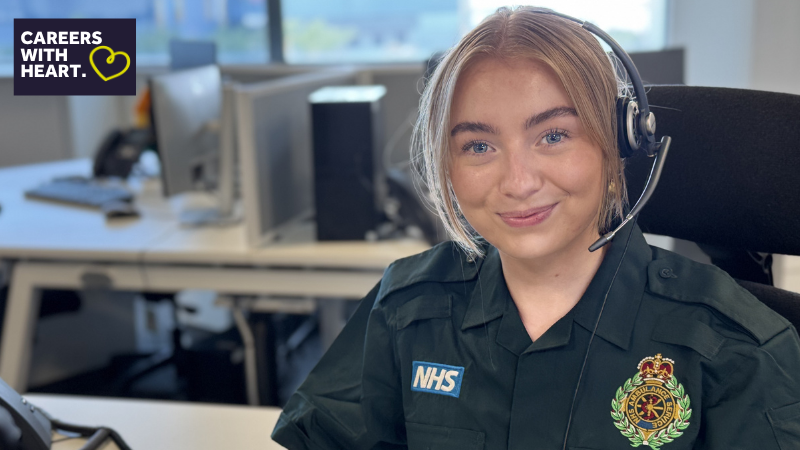 Female call handler wearing a headset smiling at the camera.