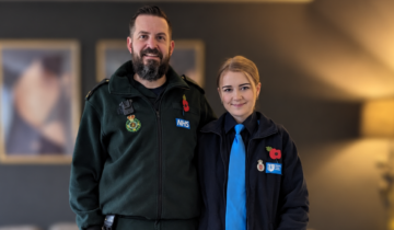 Two people in uniform; one NWAS uniform and the other a cadet uniform. Both are wearing poppies
