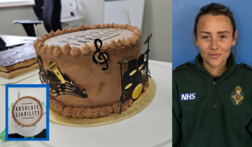 Winning cake and staff member