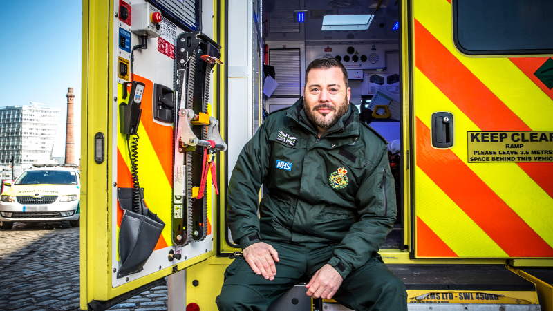 Paramedic Sat in the back of an ambulance