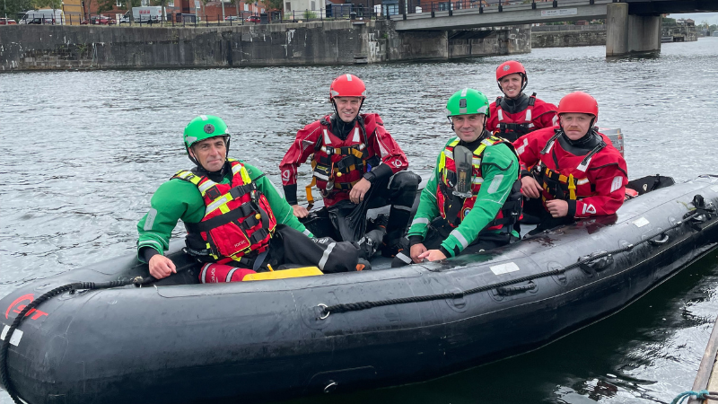 Our Hazardous Area Response Team paramedics with firefighters from Merseyside Fire and Rescue Service Search and Rescue Team in an inflatable boat in Queen's Dock, Liverpool.