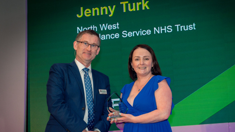 Daren Mochrie presents awards to Jenny Turk