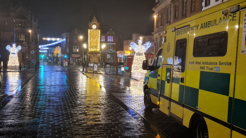 Ambulance in town with Christmas lights