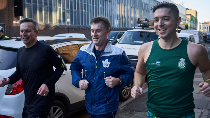 Chief Executive Daren Mochrie and London Ambulance Chielf Executive Daniel Elkeles running with paramedic.